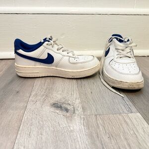 Nike White Low-Top Sneakers with Blue Swoosh